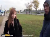 Busty redhead blowjob in a park