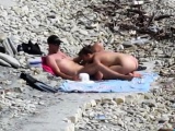 Couple fucked on a public beach while as people walked near