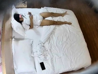 Cute amateur asian web cam girl playing with her toy